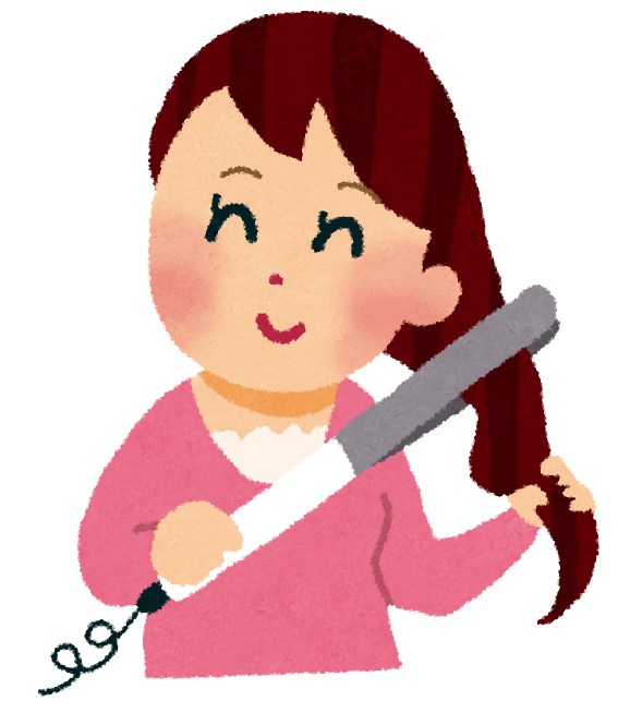 ヘアアイロンで髪をセットしている女性