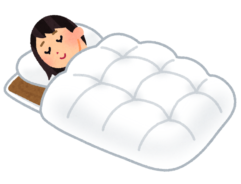 布団で寝ている女性